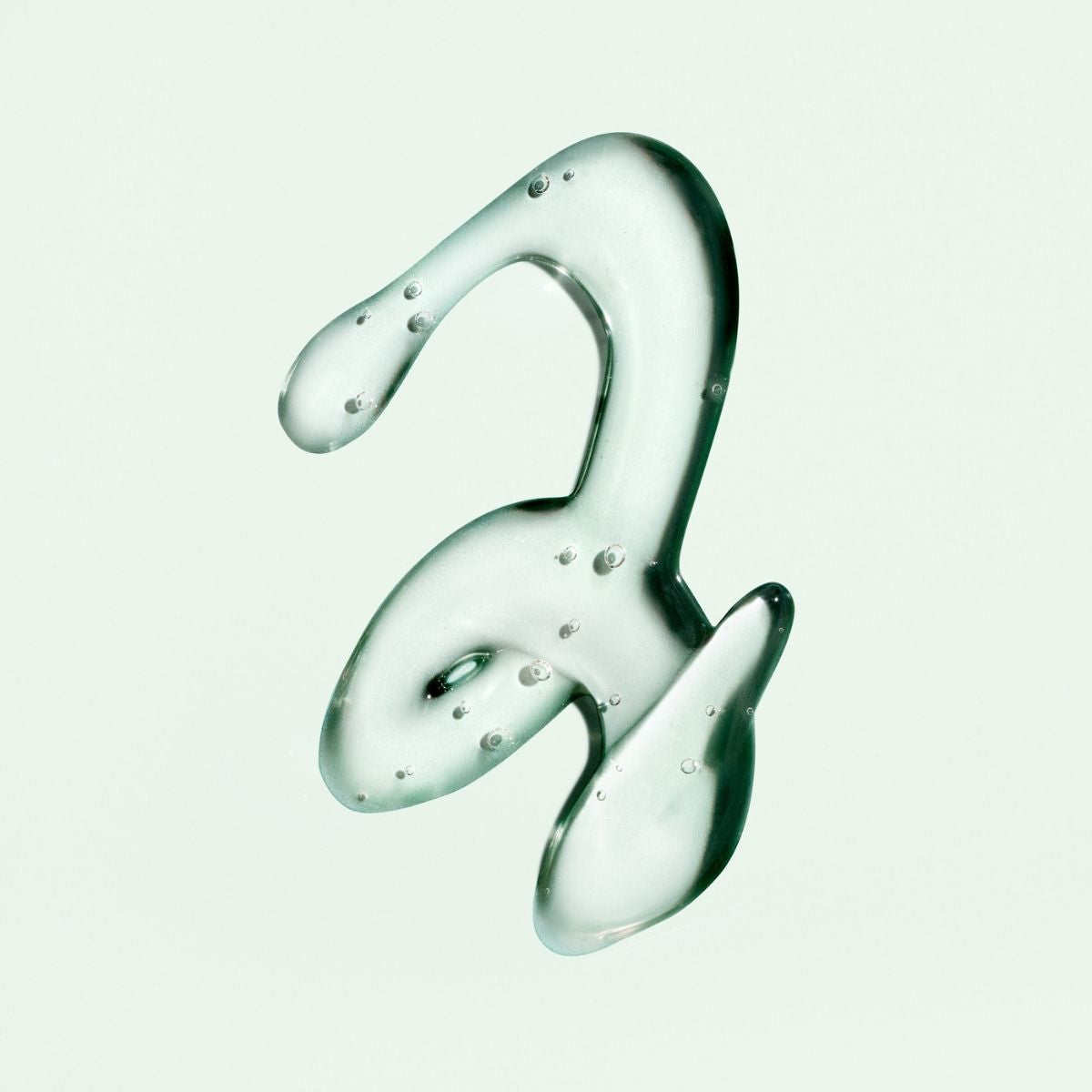 Oribe Curl Gloss – Close-Up Texture Showing Professional Haircare for Defined, Shiny Curls