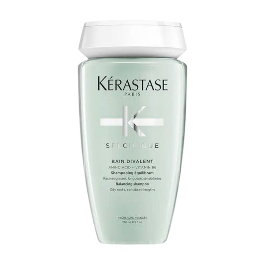 Kérastase Spécifique Bain Divalent shampoo bottle — balances oily roots and dry ends while maintaining a healthy scalp and hair.