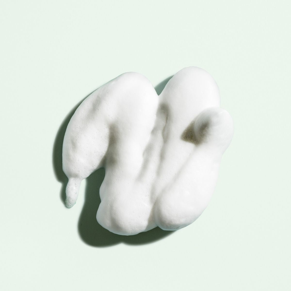 Oribe Curl Shaping Mousse – Close-Up Texture Showing Professional Haircare for Defined, Bouncy Curls