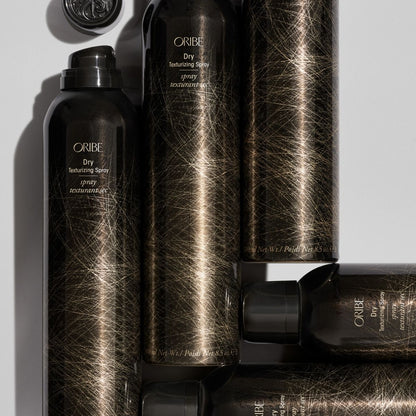 Oribe Dry Texturizing Spray – Angled View of 4 Bottles for Volumizing, Textured Hair