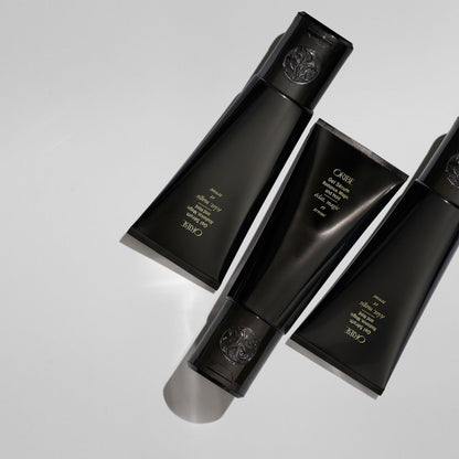 Oribe Gel Serum – Luxury Haircare Styling Gel, Photo of Three Tubes Angled for Display