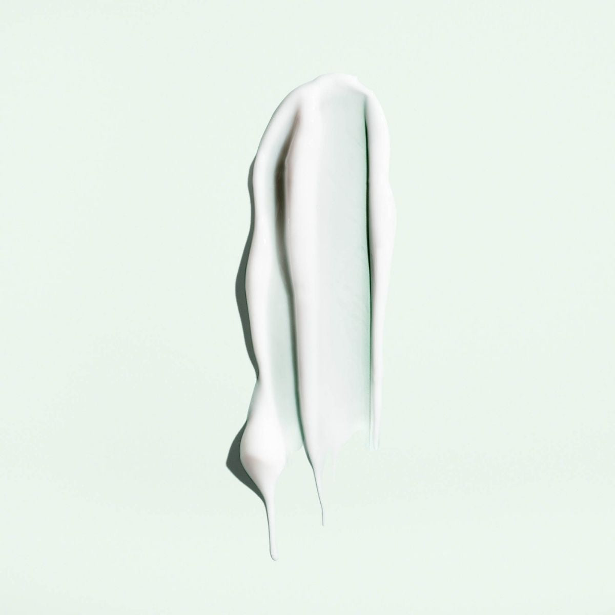 Oribe Straight Away Cream – Close-Up Texture Showing Smooth, Professional Hair Treatment