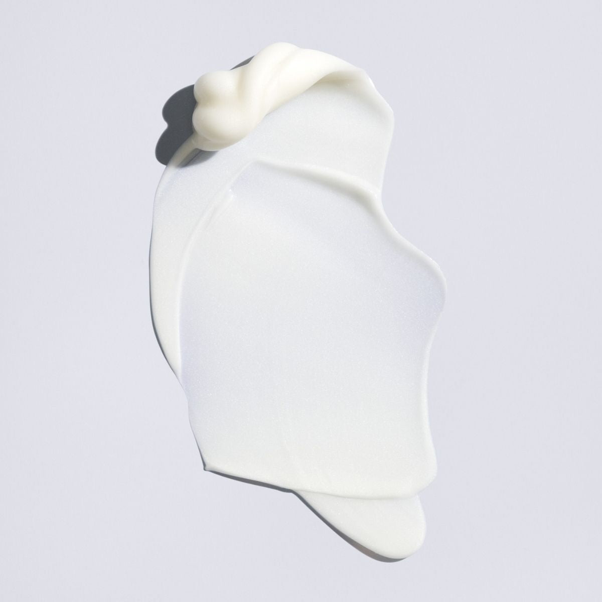 Oribe Supershine Light Moisturizing Cream – Close-Up Texture of Smooth, Lightweight Hair Treatment